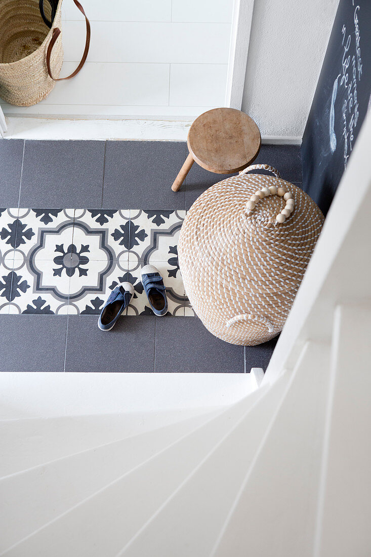 Basket container and stool in the hallway with Portuguese tiles