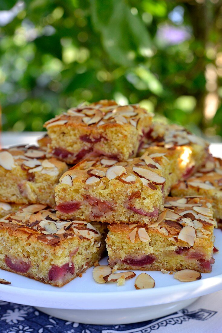 Cherry cake from the tray with almonds