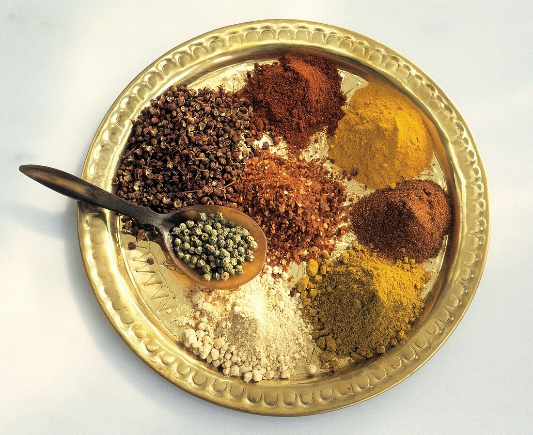 Assorted Exotic Spices on Brass Platter