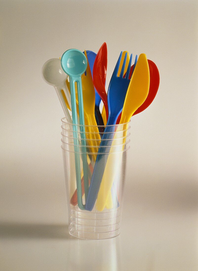 Colorful Plastic Utensils in a Plastic Cup