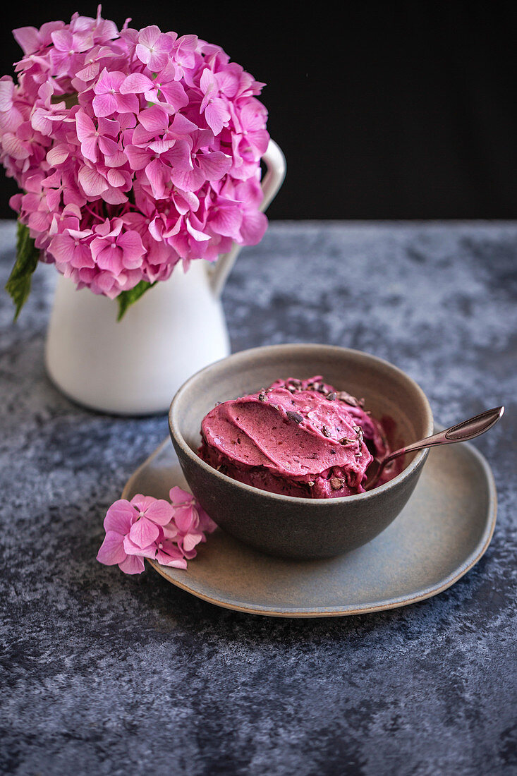 Blueberry banana ice cream in a grey ceramic bowl