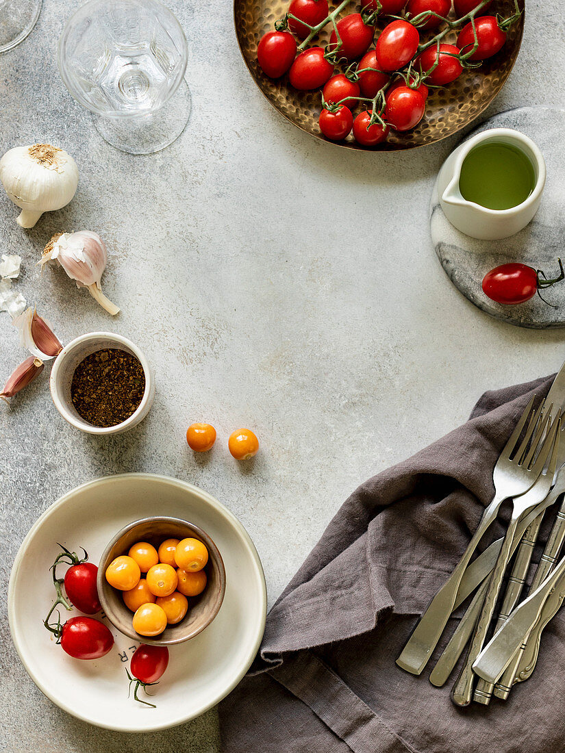 Ingredinets for baked feta cheese with cherry tomatoes and herbs