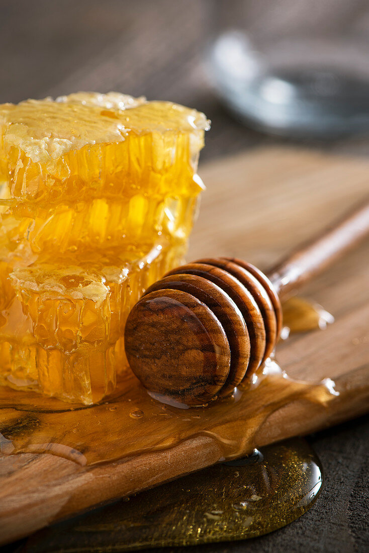 Honeycomb, honey spoon and honey