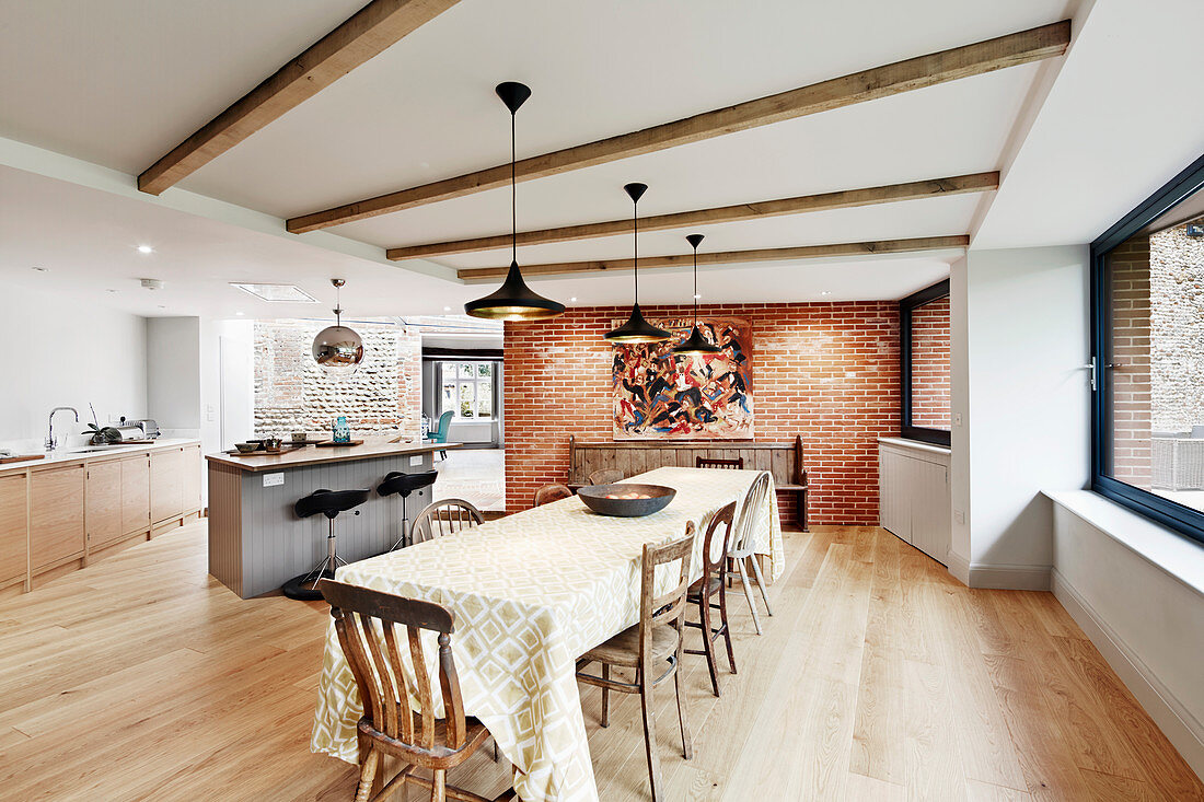 View of light and bright open plan kitchen and dining room leading onto patio