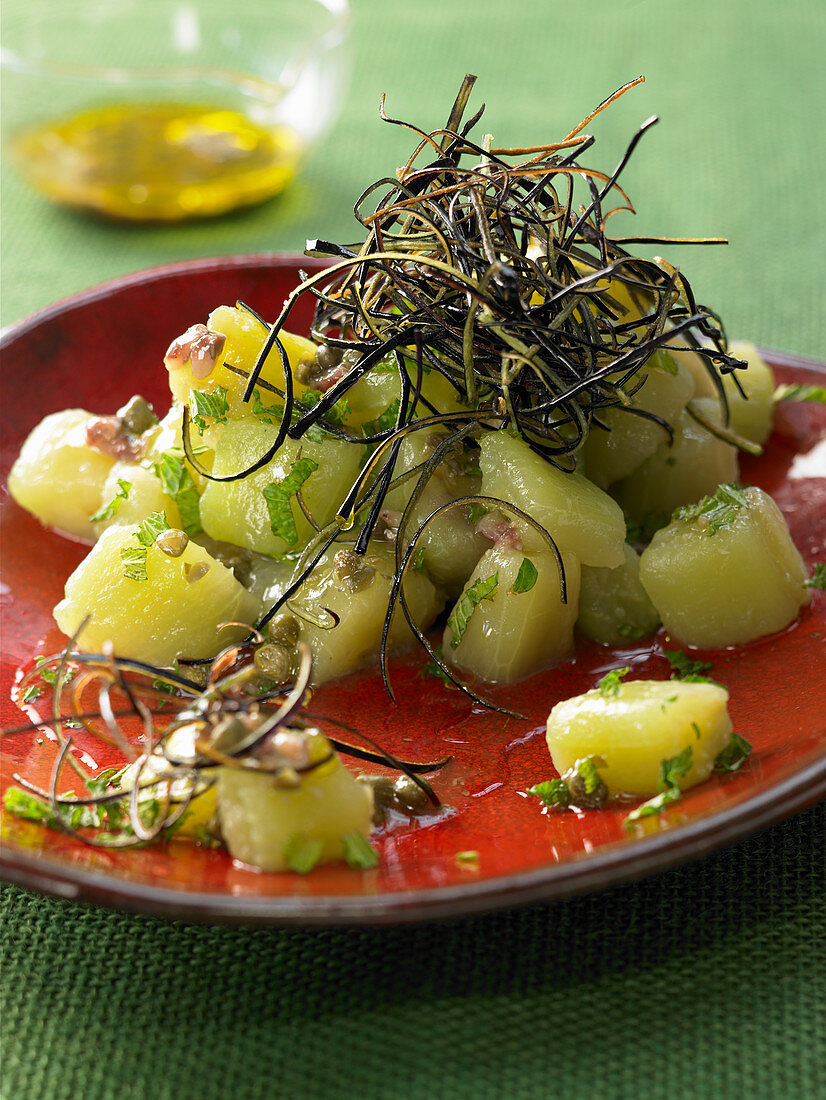 Marinated eggplant cubes with anchovies and capers