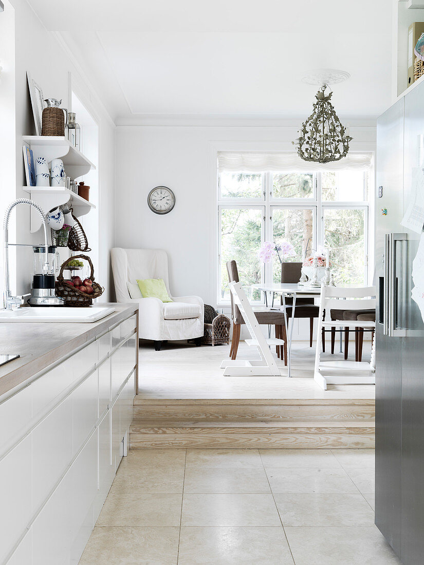 View from the open kitchen into the dining room two steps higher