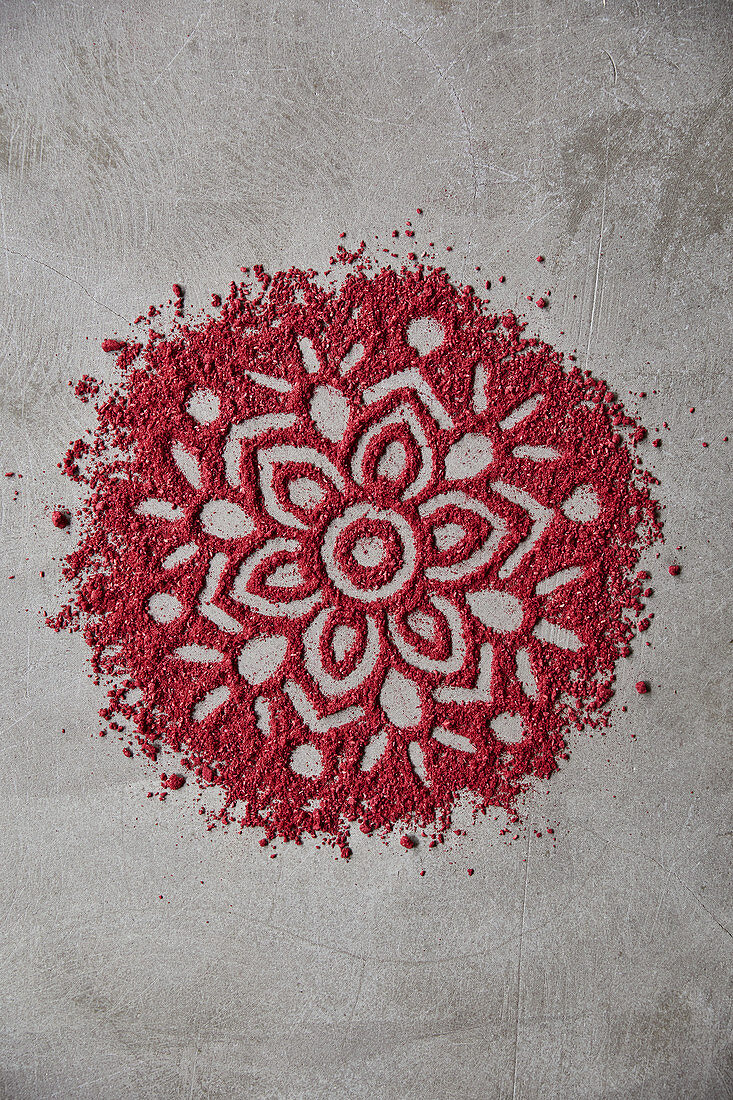A mandala pattern made from strawberry powder
