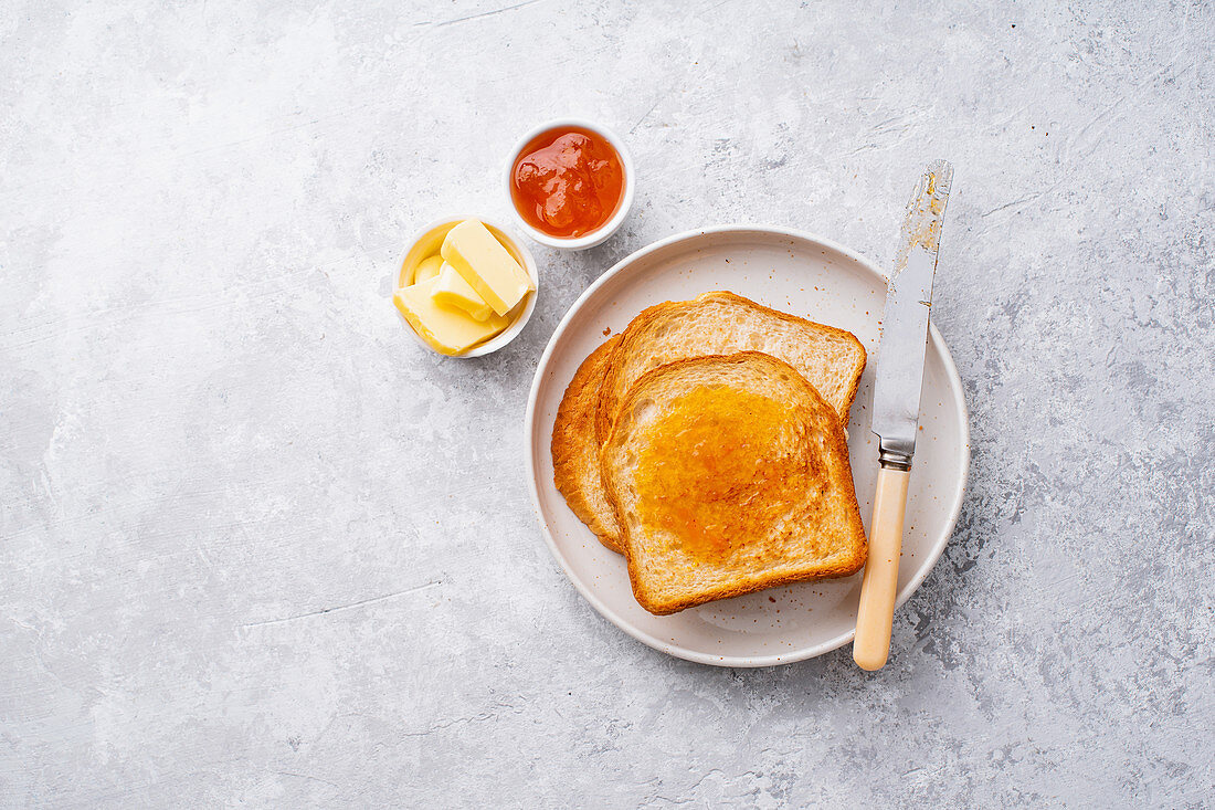 Morning toasts with butter and confiture