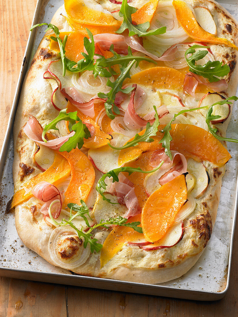 Pumpkin and onion pizza with apple and bacon