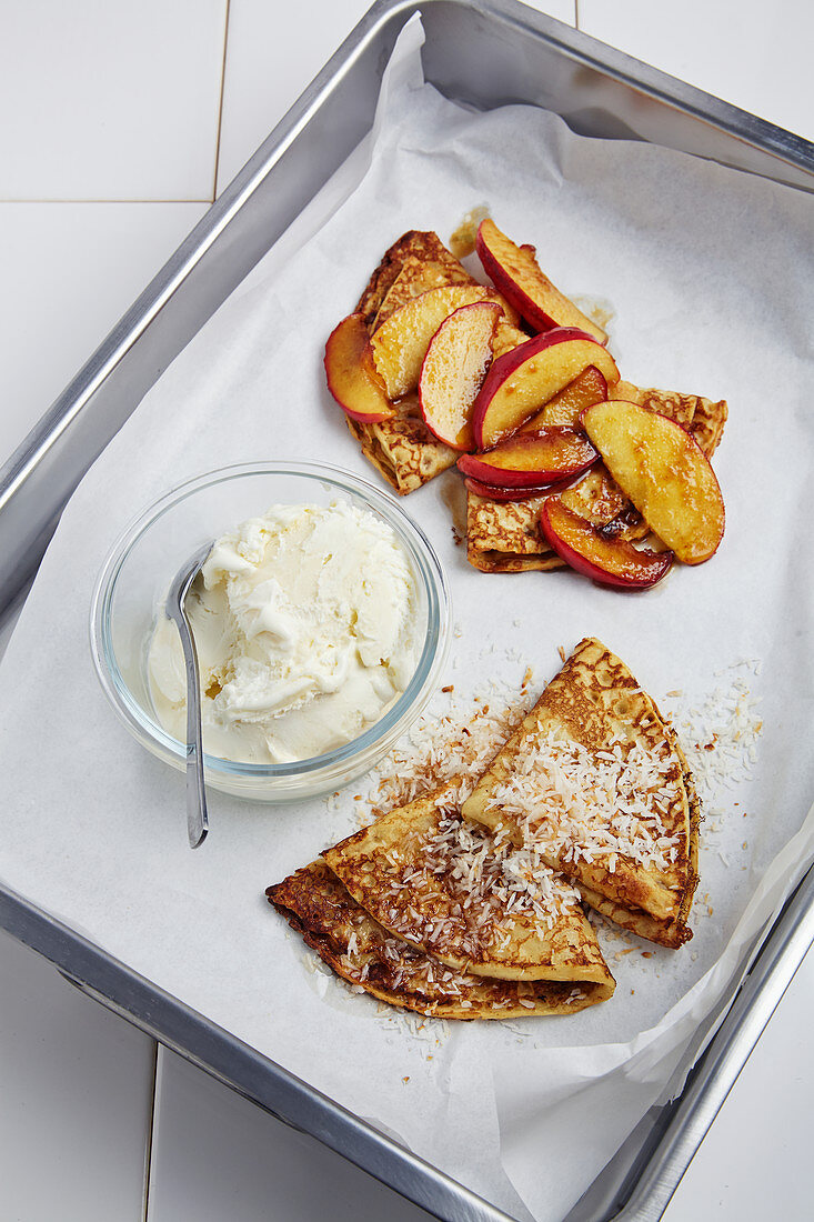 Pancakes with peaches and ice cream