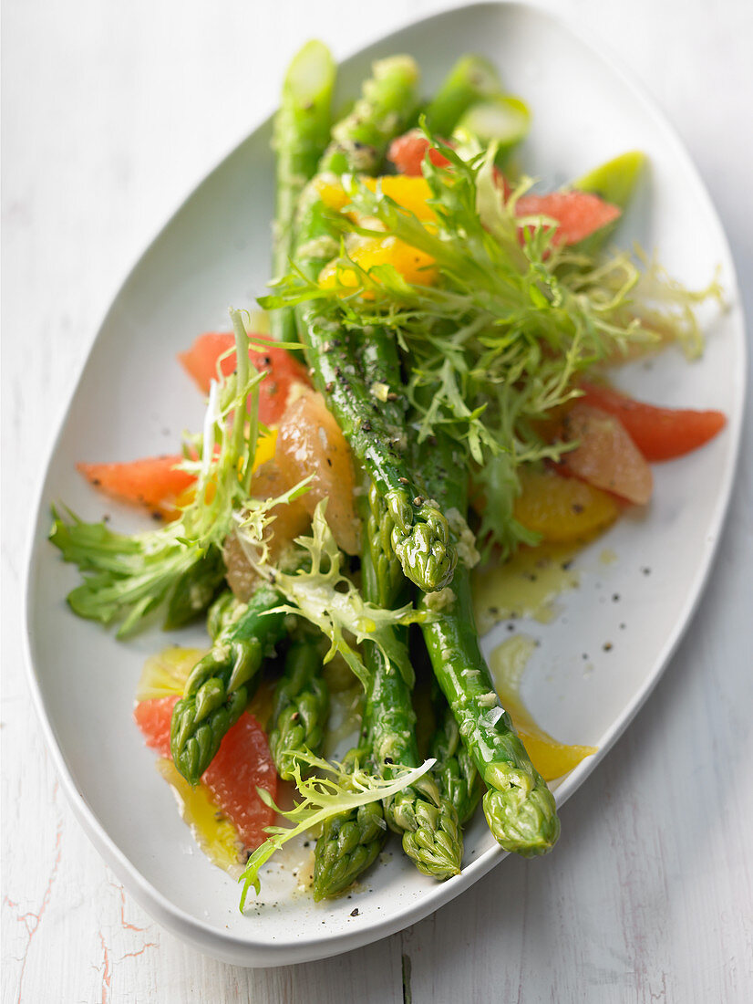 Frisee lettuce with asparagus and citrus fruit