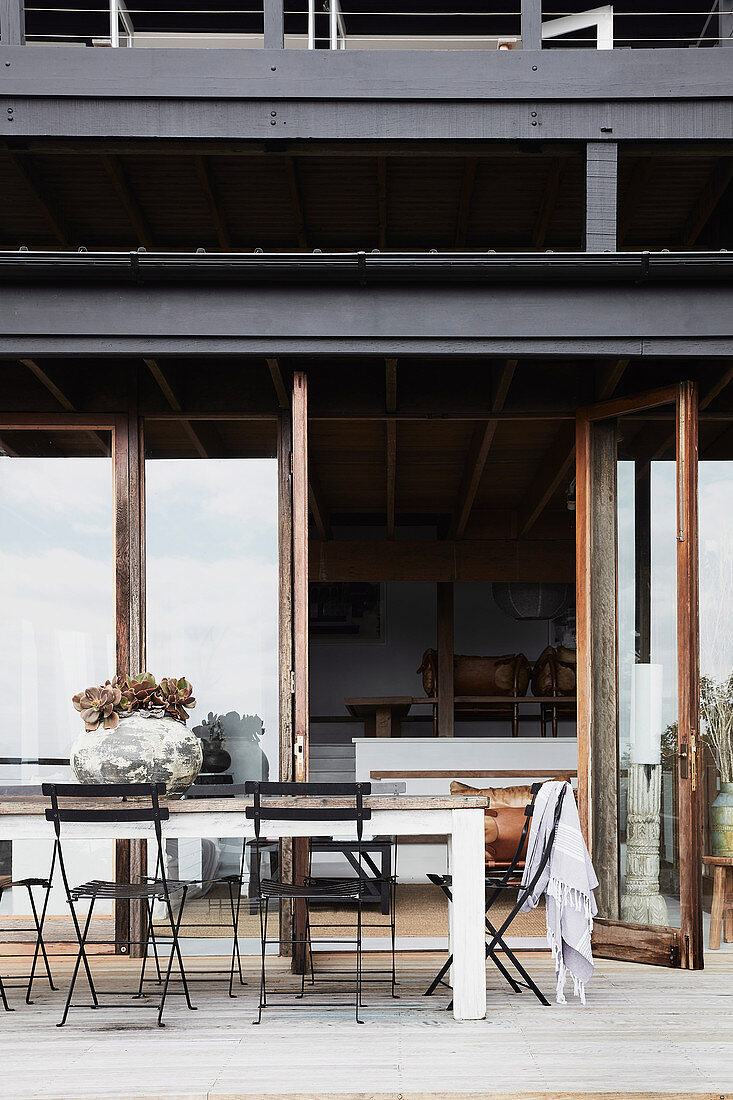 Table with folding chairs on the terrace