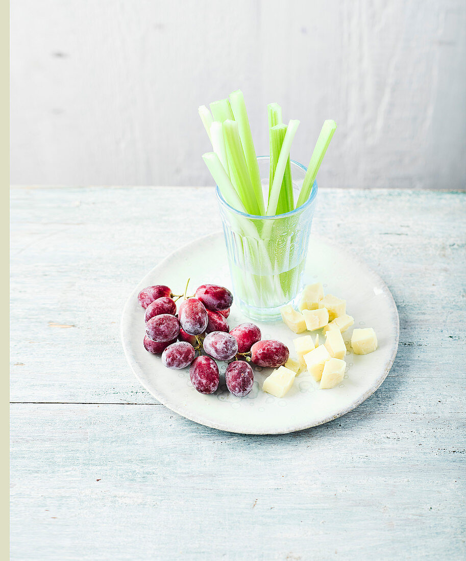 Frozen grapes with cheese and celery sticks