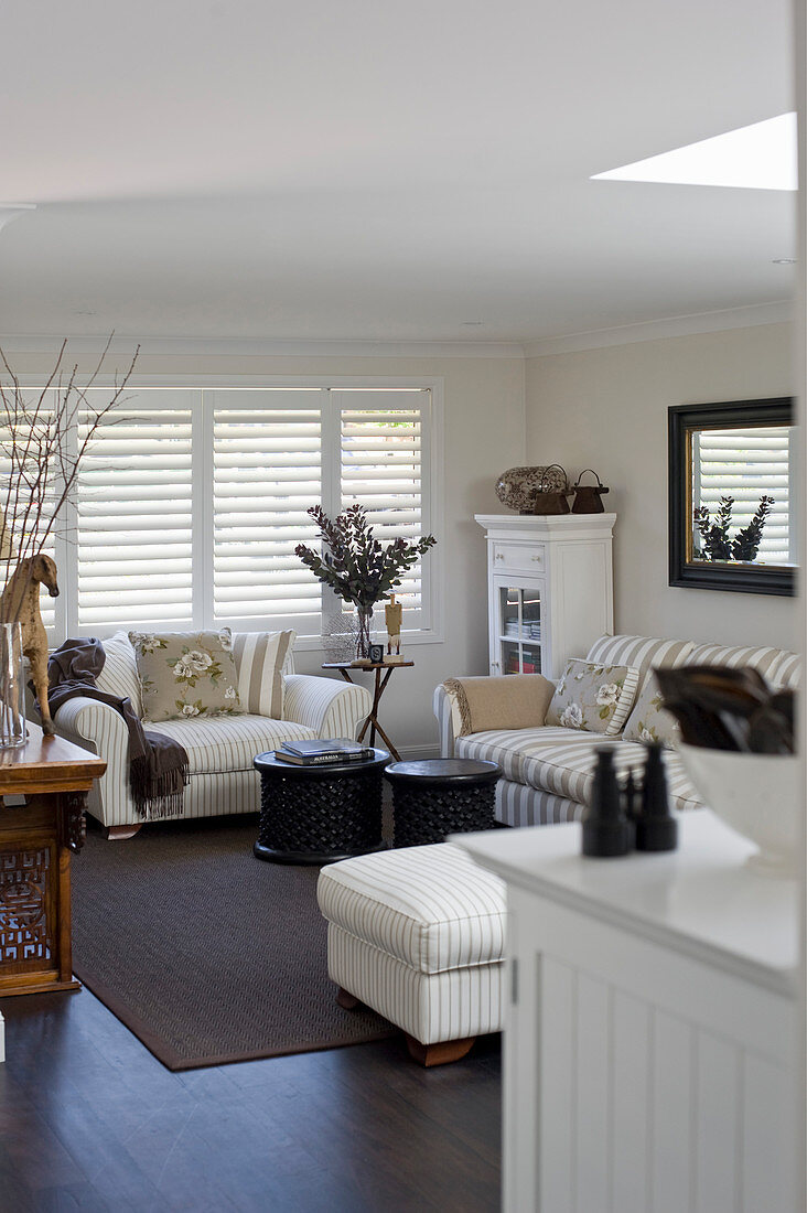 Beige-and-white striped sofa in classic living room