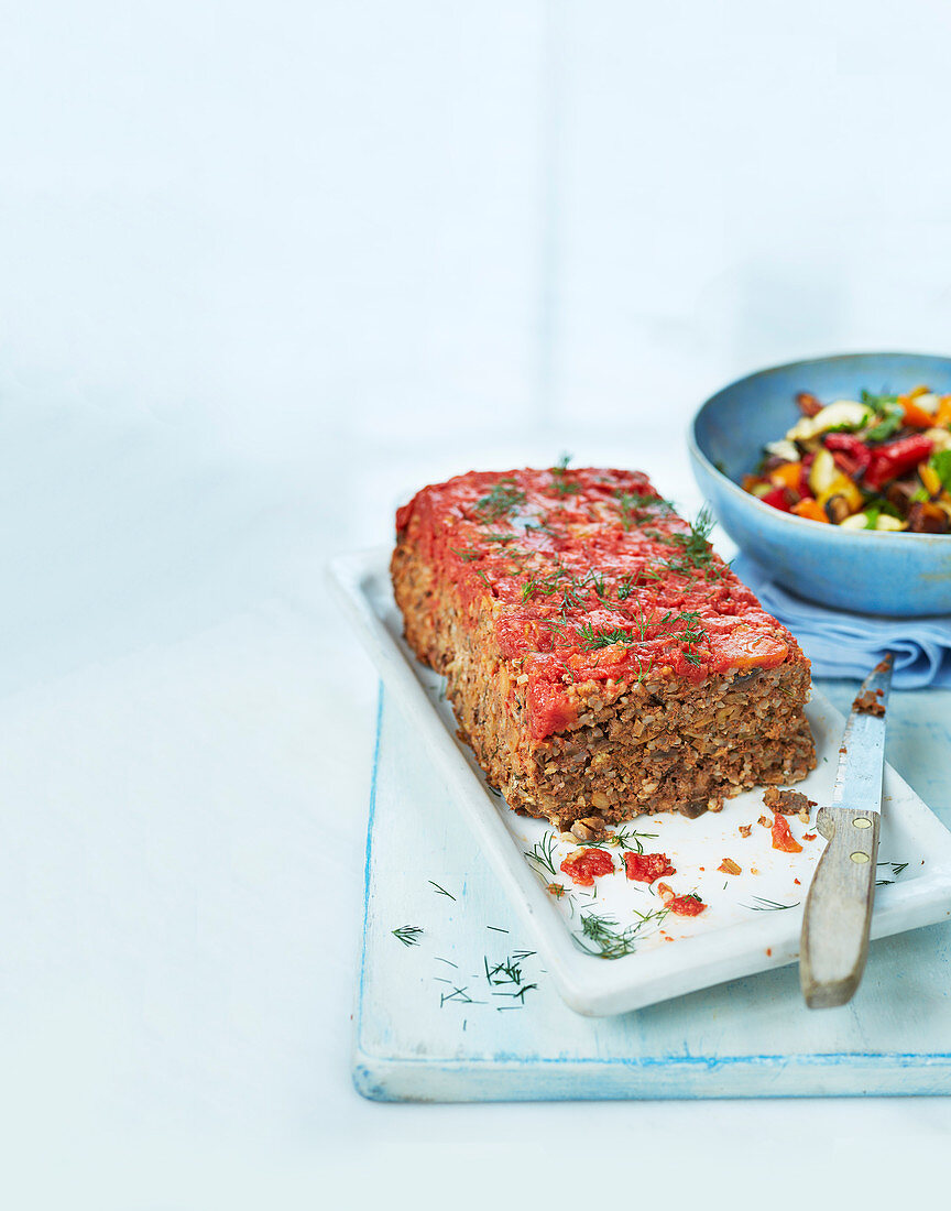 Turkish lamb meatloaf served with a vegetable salad