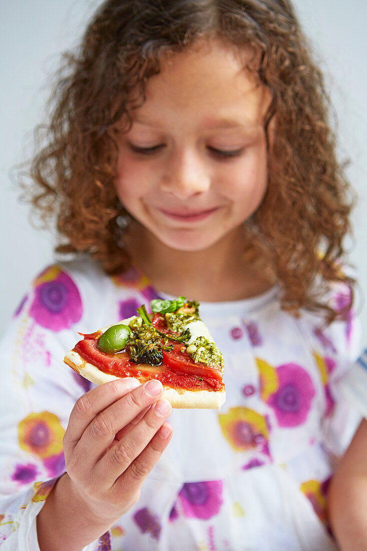 Girl with a rainbow pizza