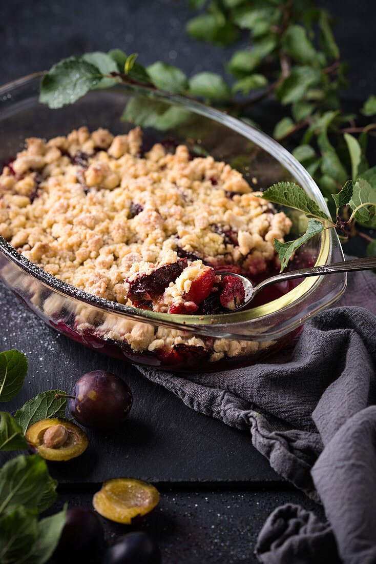 Vegan plum crumble in a baking dish