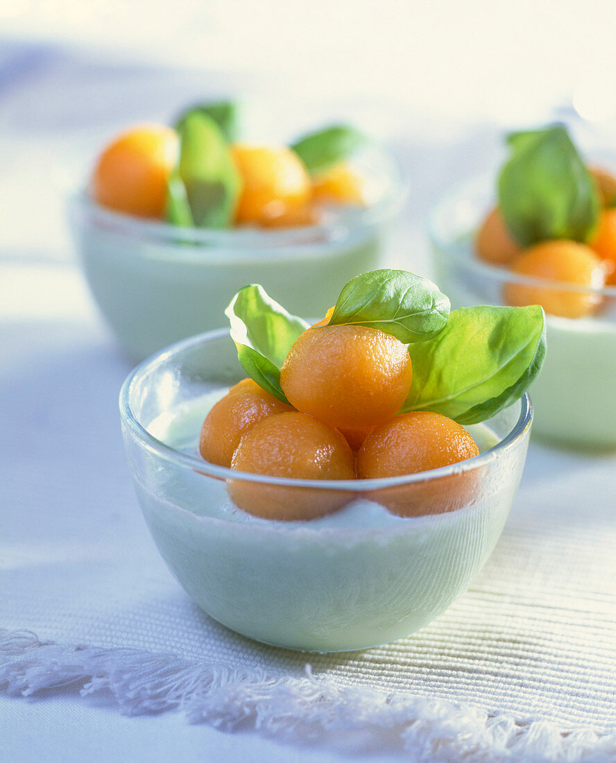 Melon cream with melon balls and basil