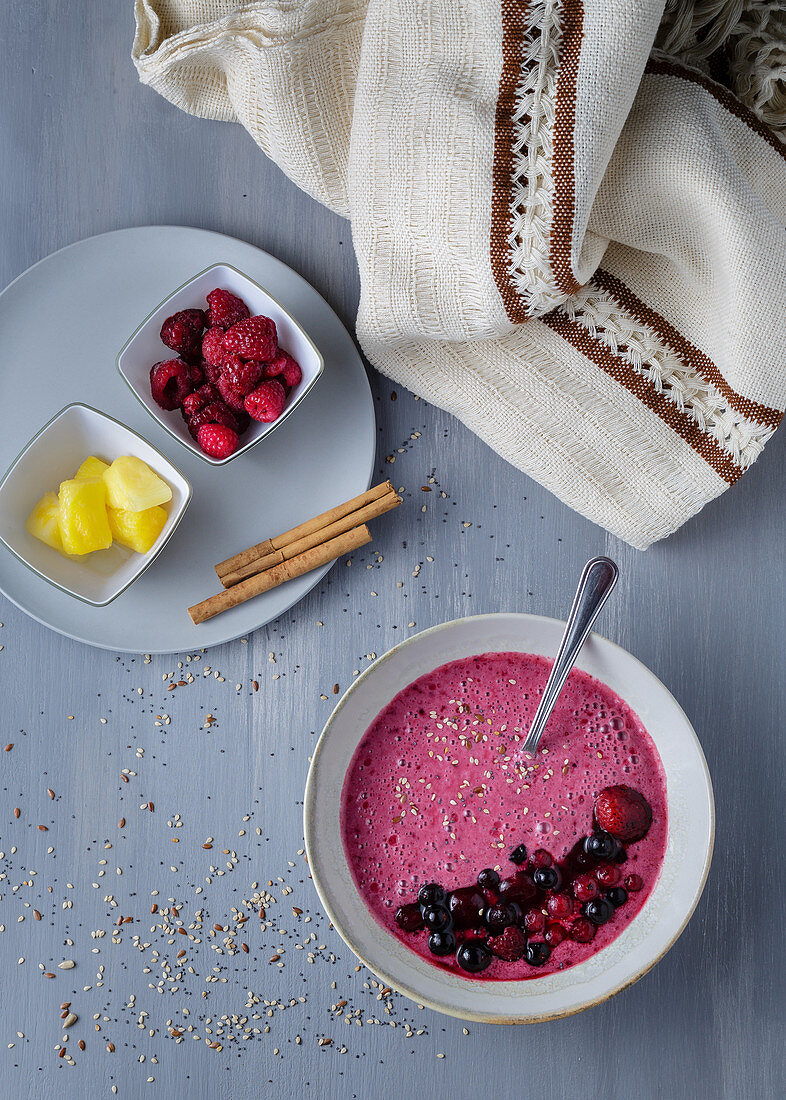 Smoothie bowl with fresh berries and sesame