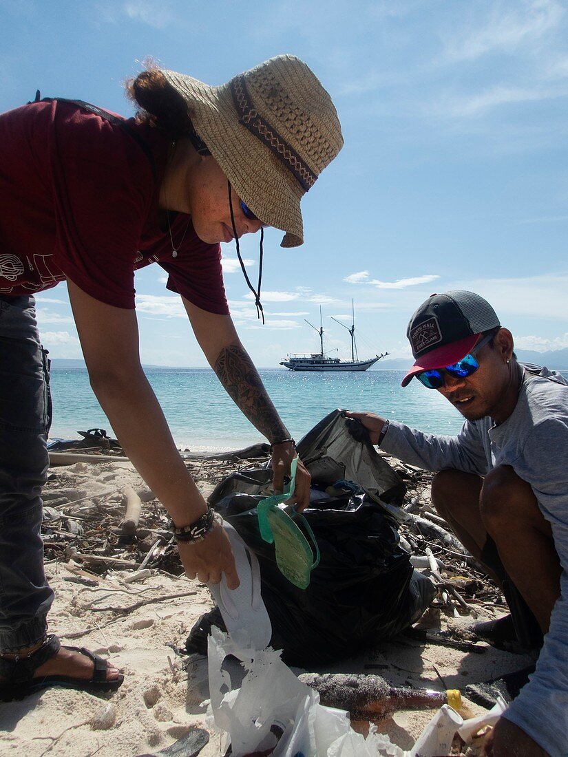 Collecting plastic waste on a beach,Indonesia