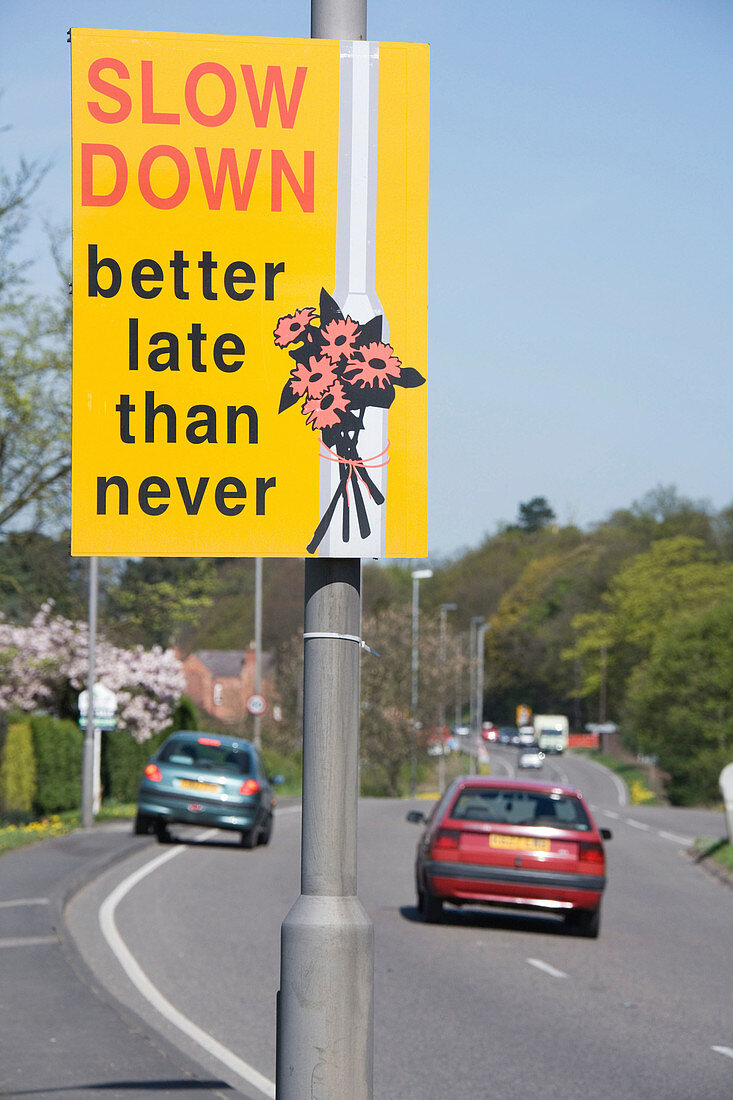 Road sign encouraging motorists to slow down