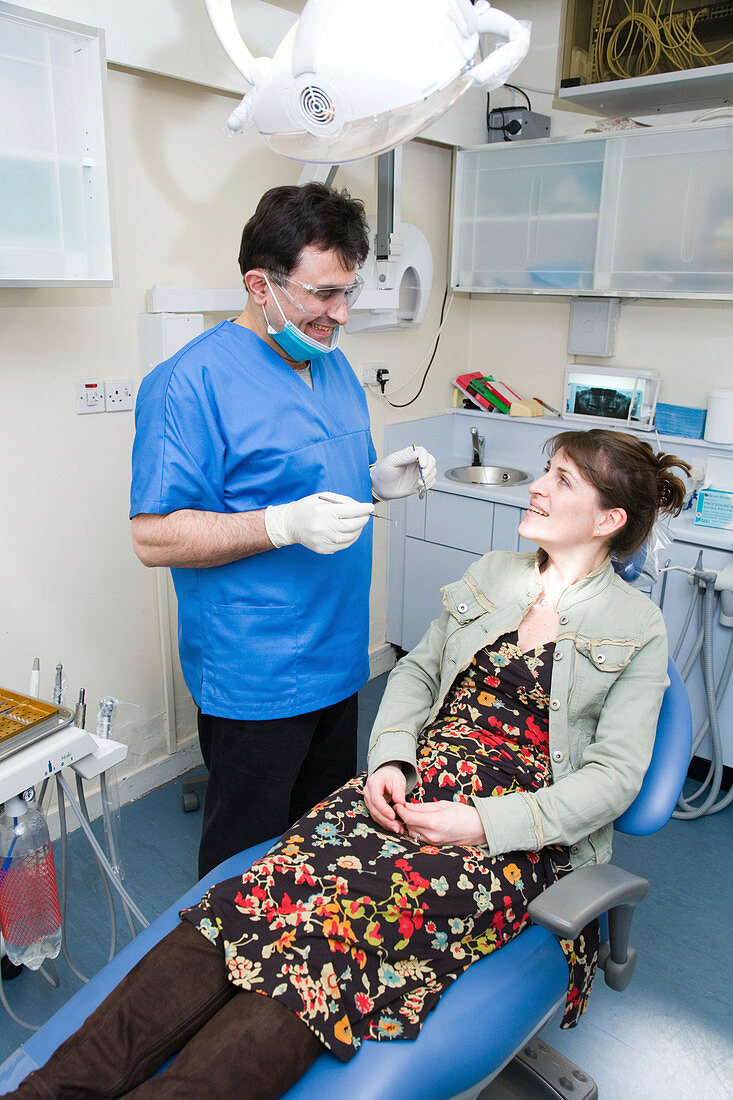 Dentist in consultation with patient