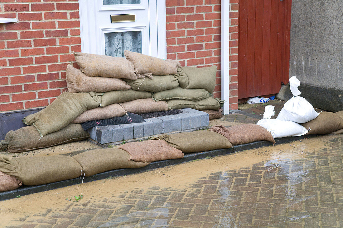 Sandbags propped up outside a front door