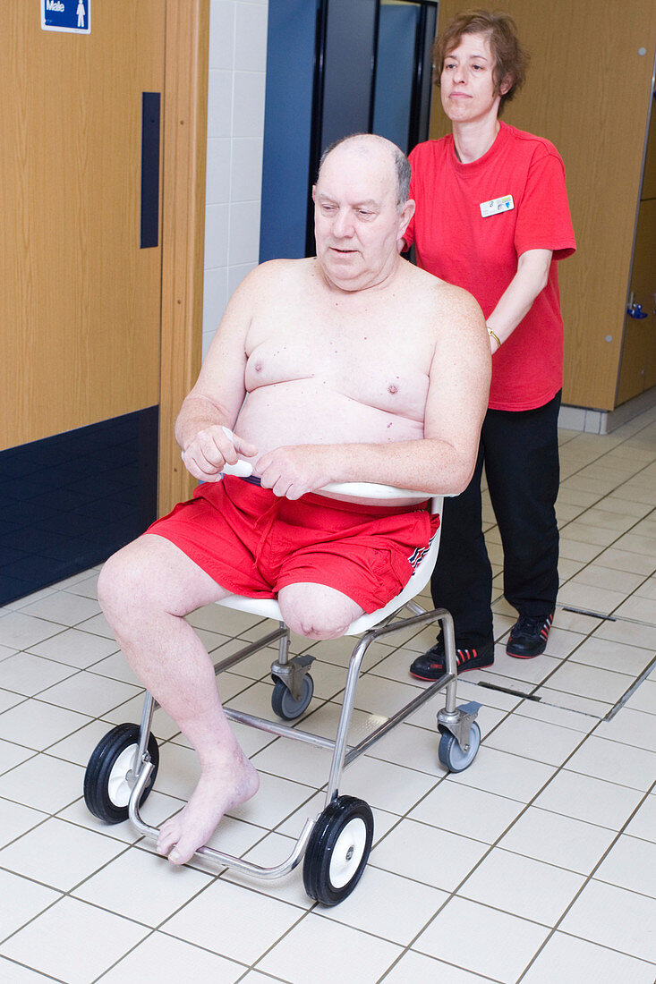 Disabled man making his way to the swimming pool
