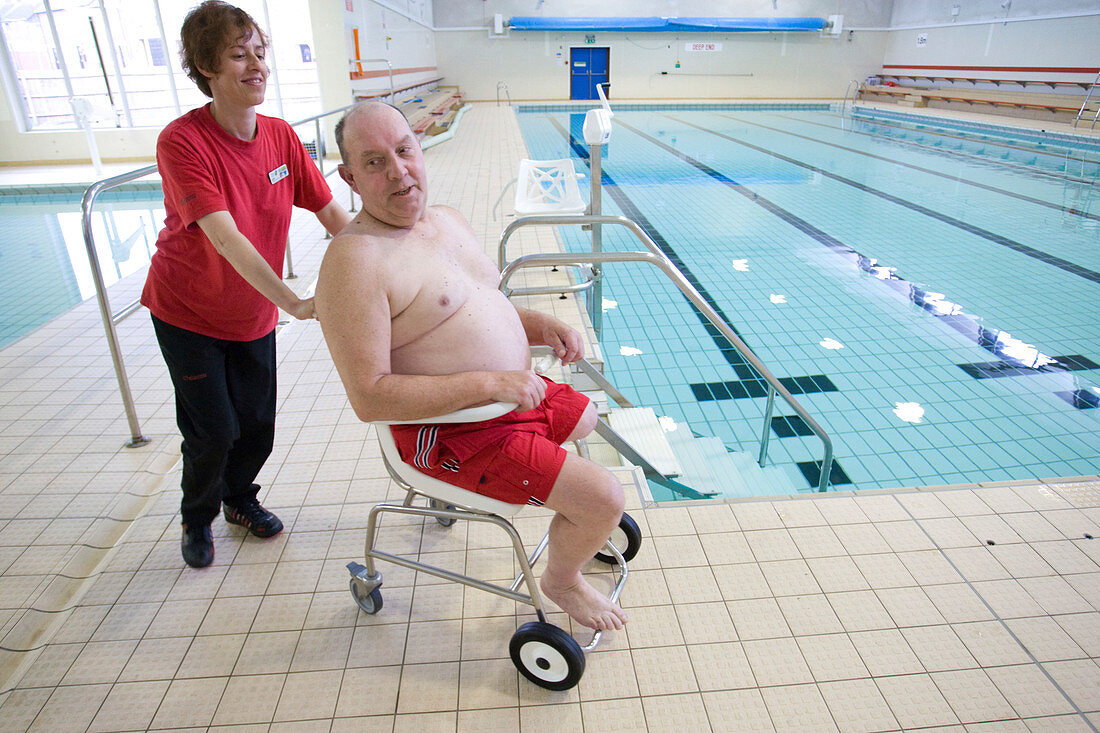 Disabled man leaving a swimming pool