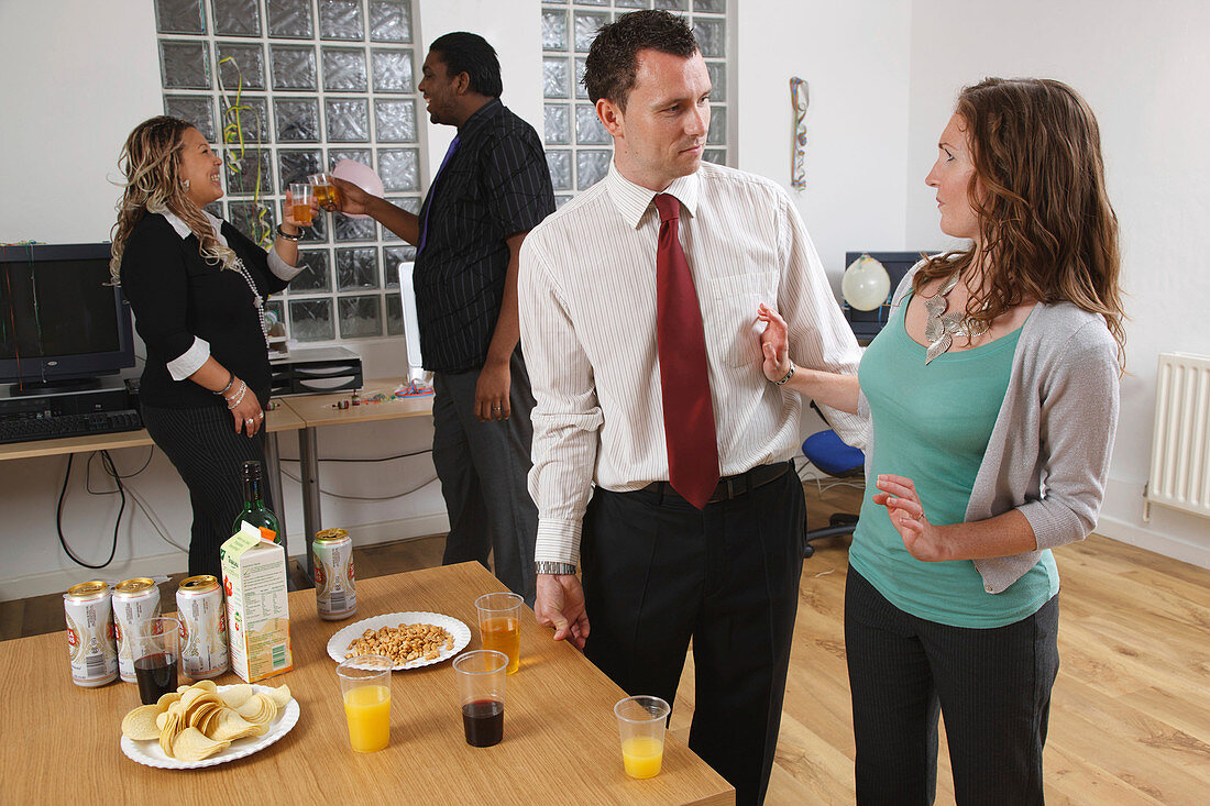 Woman rejecting unwanted advances from man at party