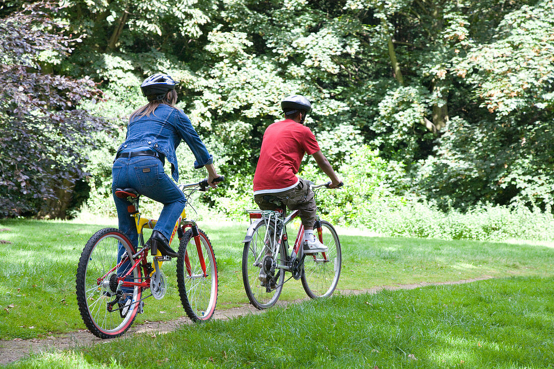 Woman and teenager out in the countryside cycling