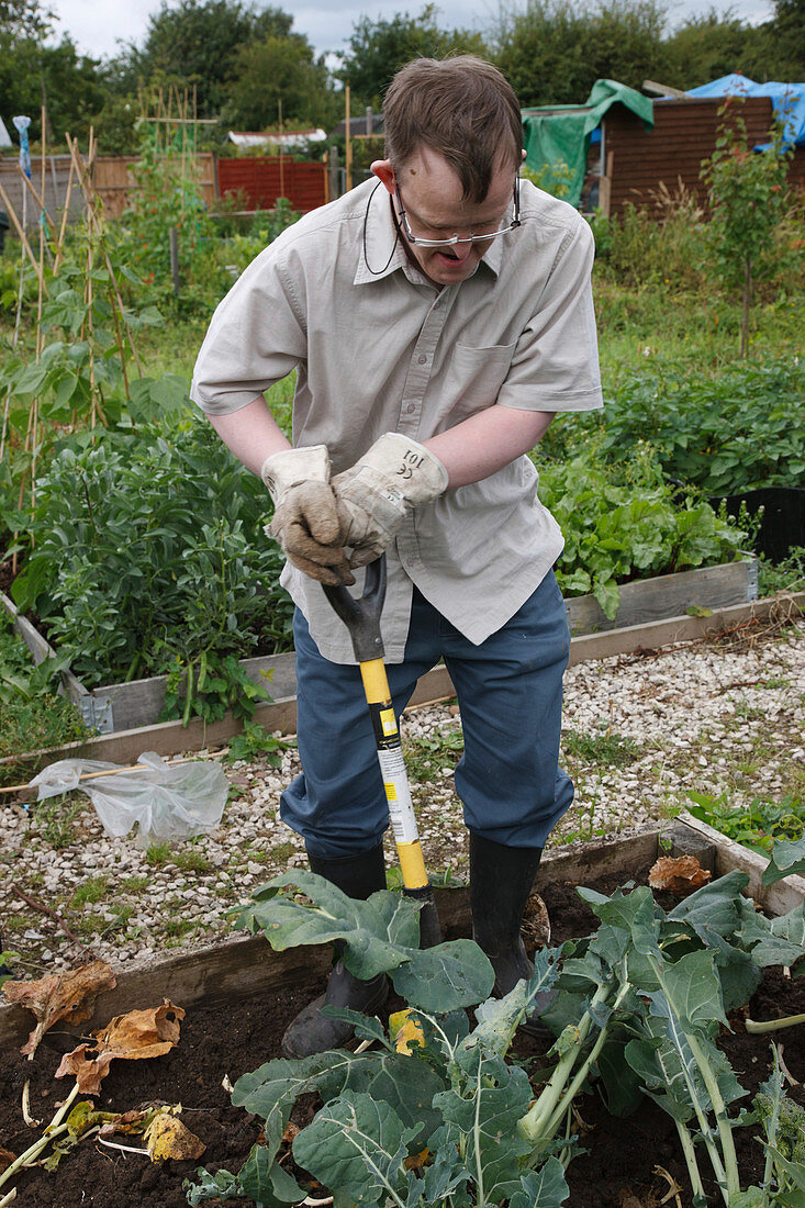 Man with learning disability working on allotment