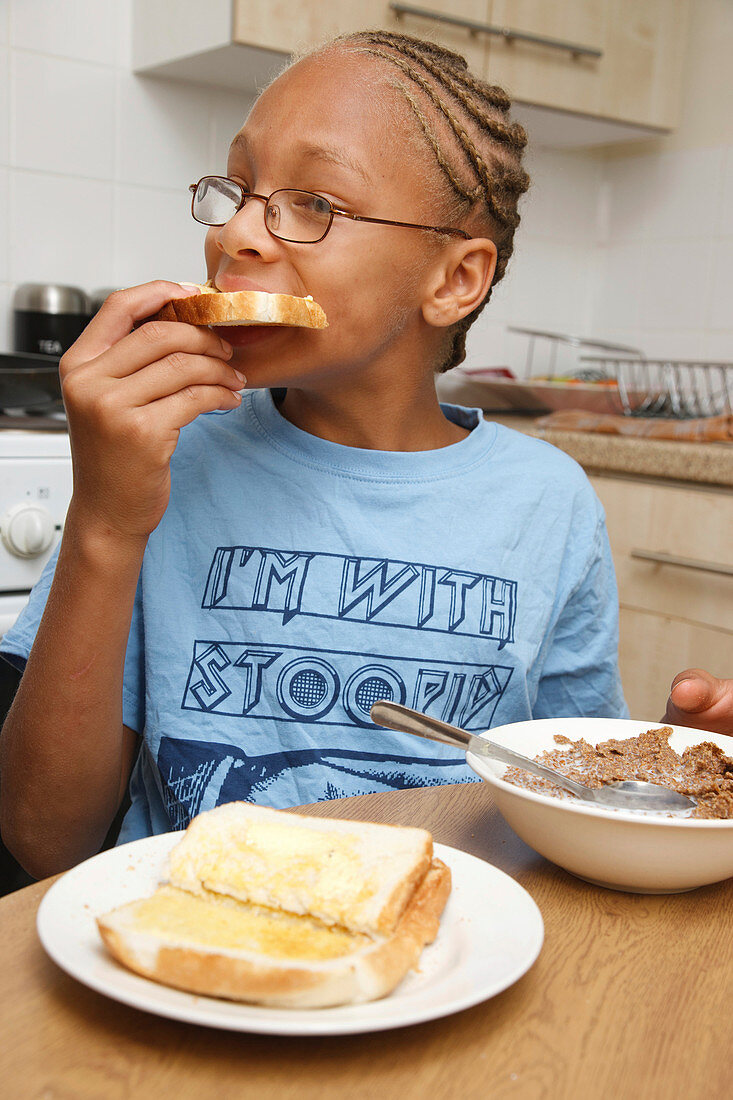 Boy eating toast