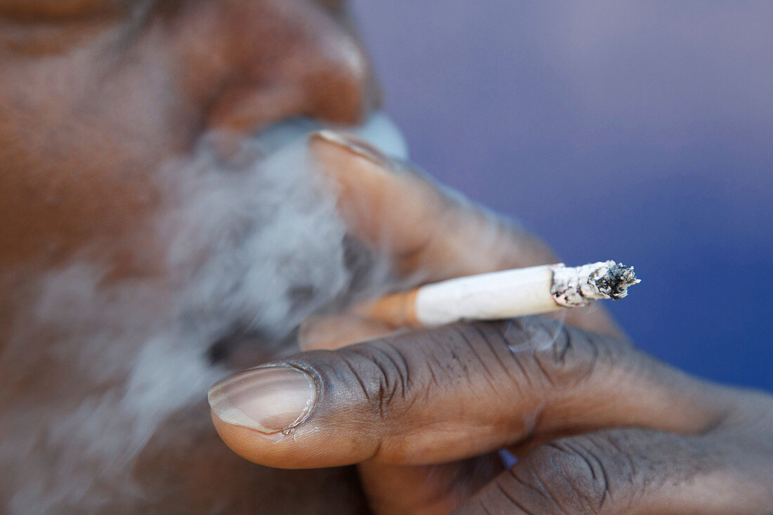 Portrait of black man smoking
