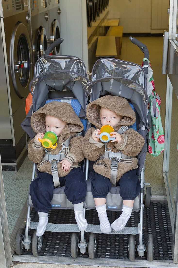 Twins in buggy at launderette