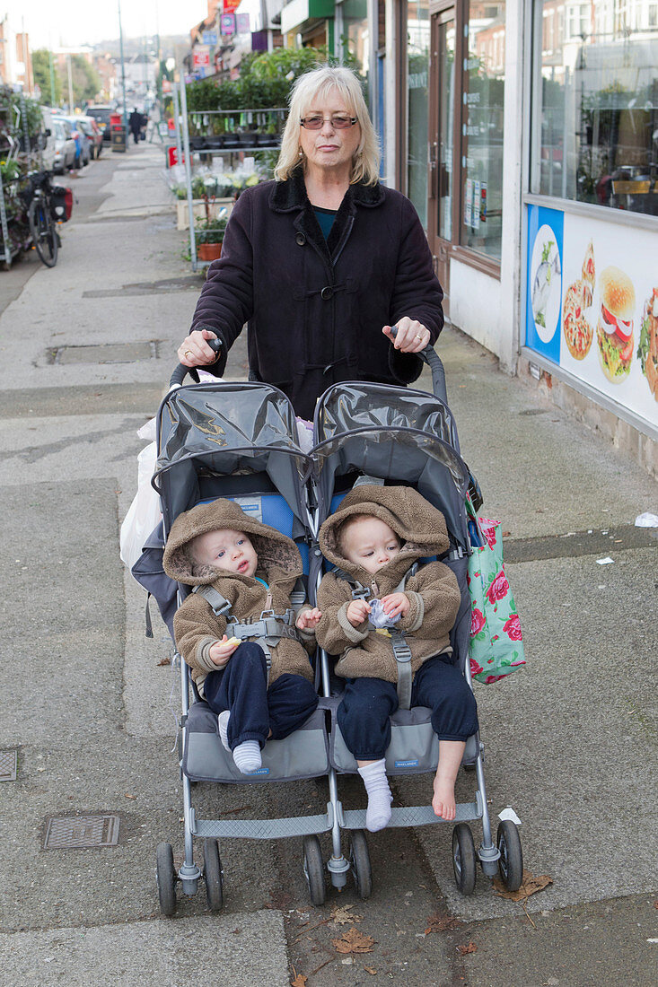 Childminder with twins in buggy