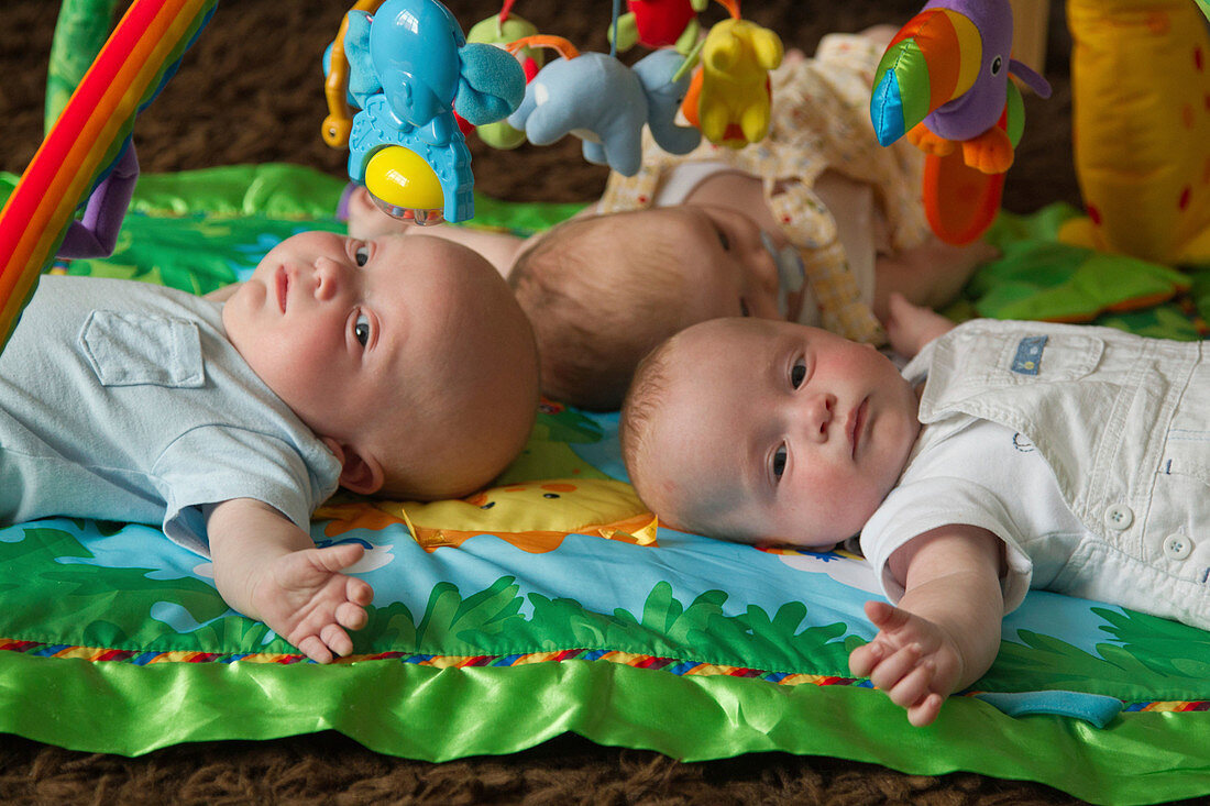 Babies on play mat
