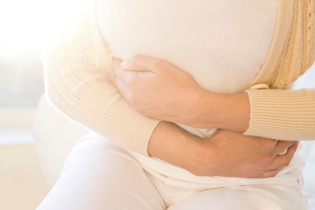 Woman holding stomach