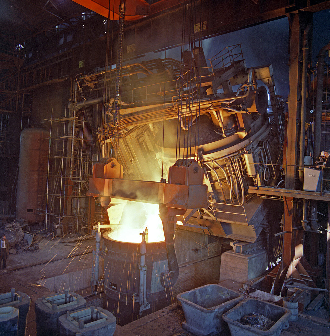 75 ton arc furnace pouring molten steel into a vessel, 1969