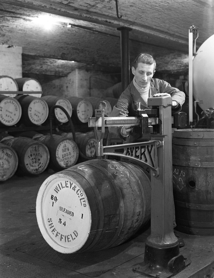 Weighing barrels of blended whisky at Wiley & Co, 1960