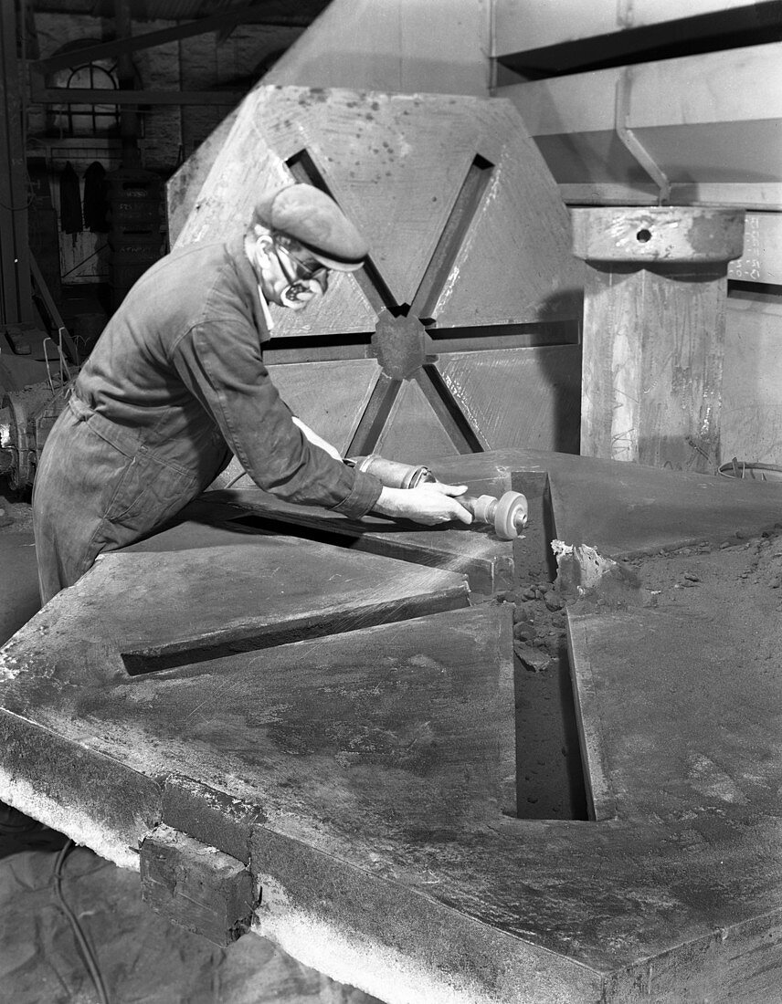 Grinding the flashing from a casting, 1963