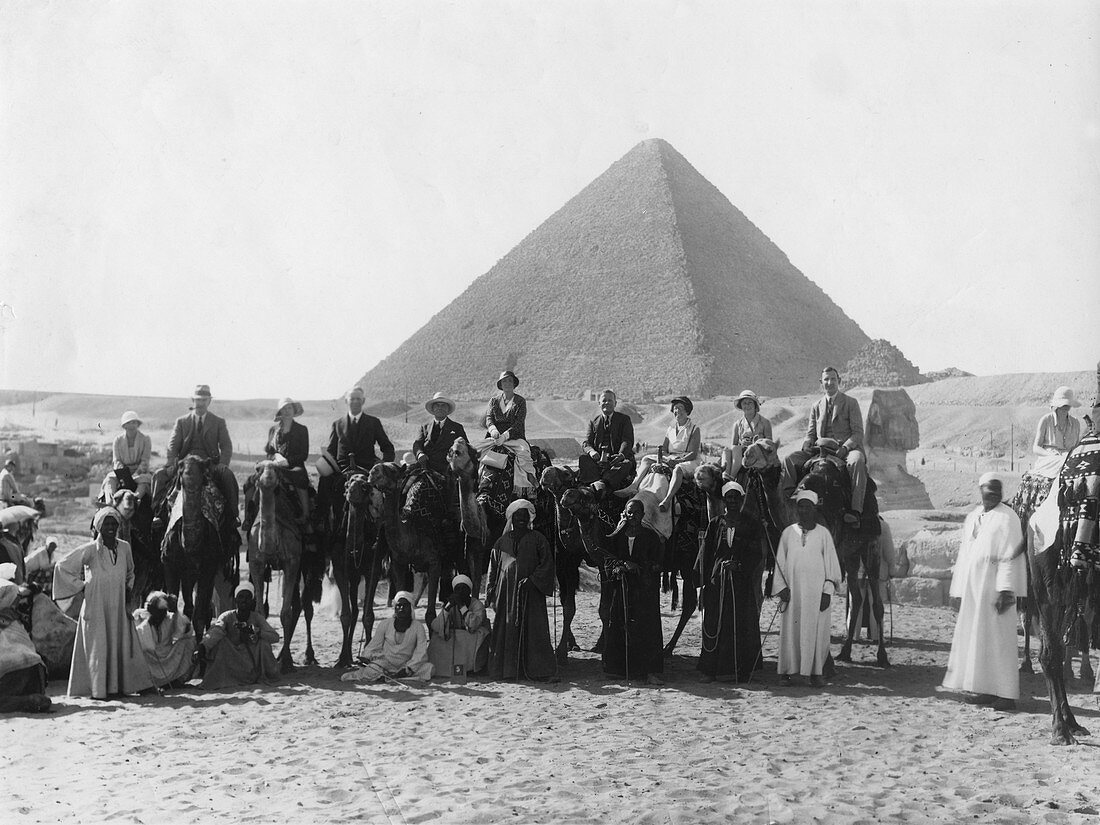 Camel tour in front of one of the Pyramids of Giza, Egypt