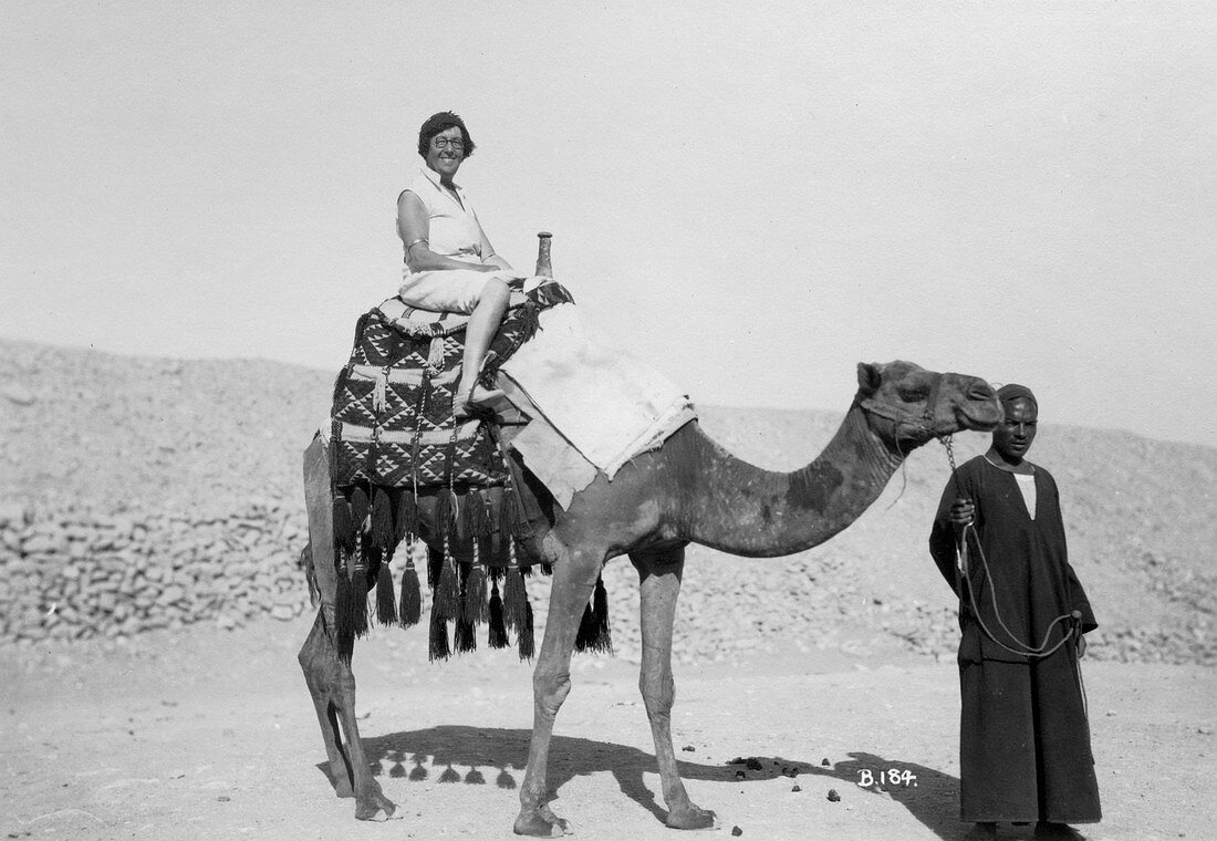 Woman on a camel tour, Egypt