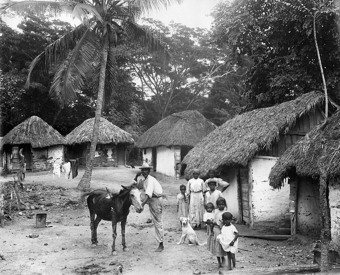 Family outside home, Coolie Street, Kingston, Jamaica, 1931