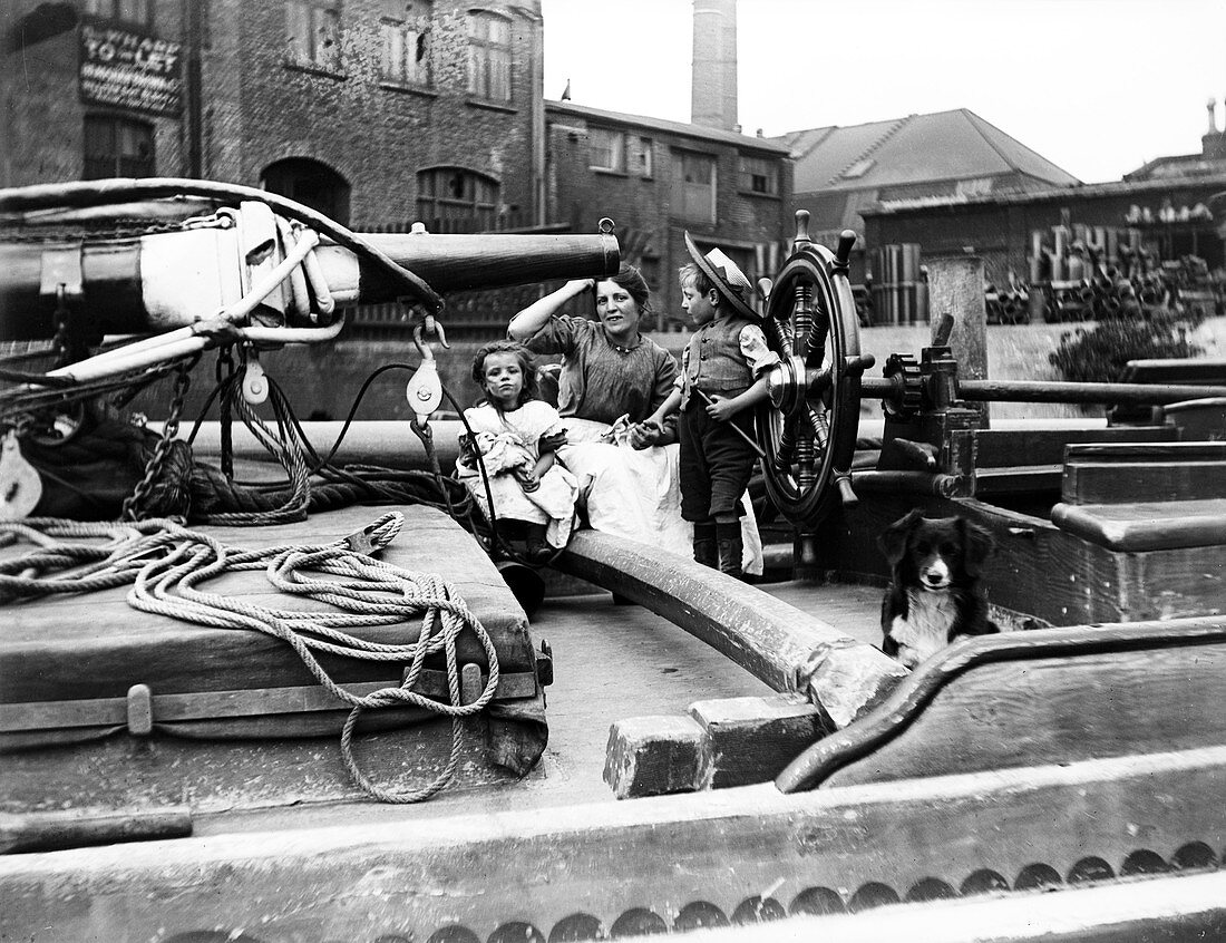 Barge family on a dumpy barge, London, c1905