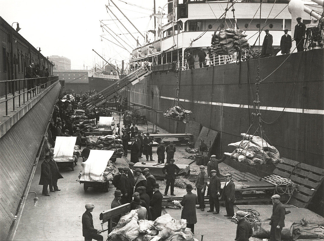 Cargo being loaded from a ship, London, c1930