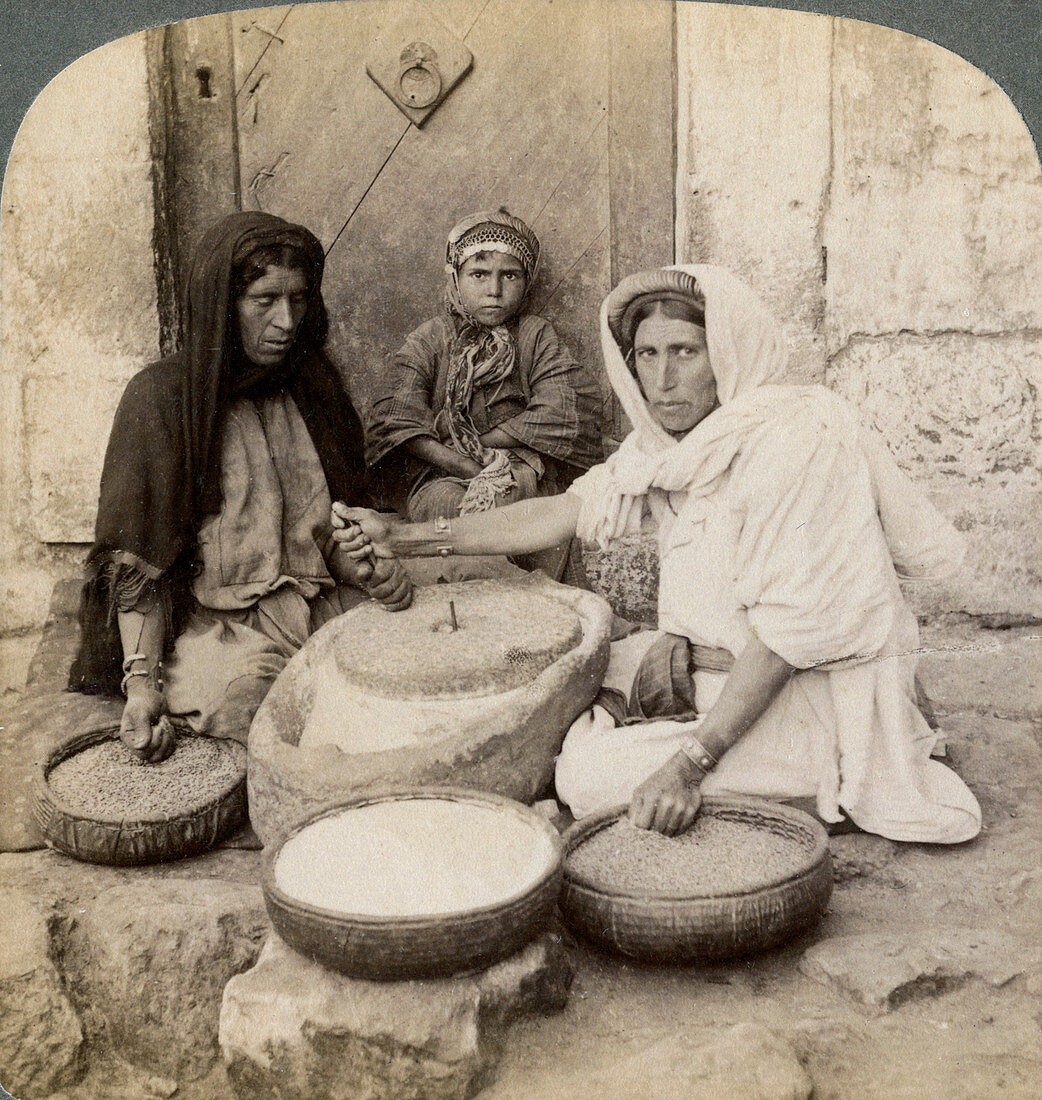 Women grinding at the mill, Palestine, 1900