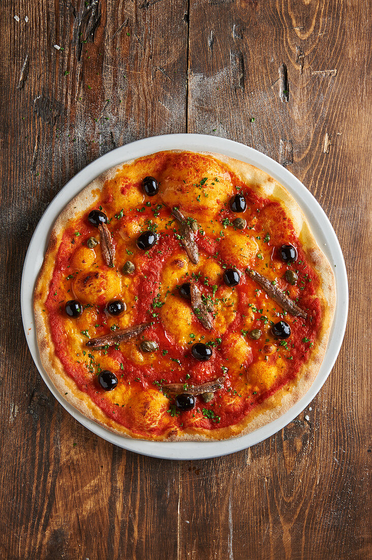 Pizza Napoli with anchovies and olives