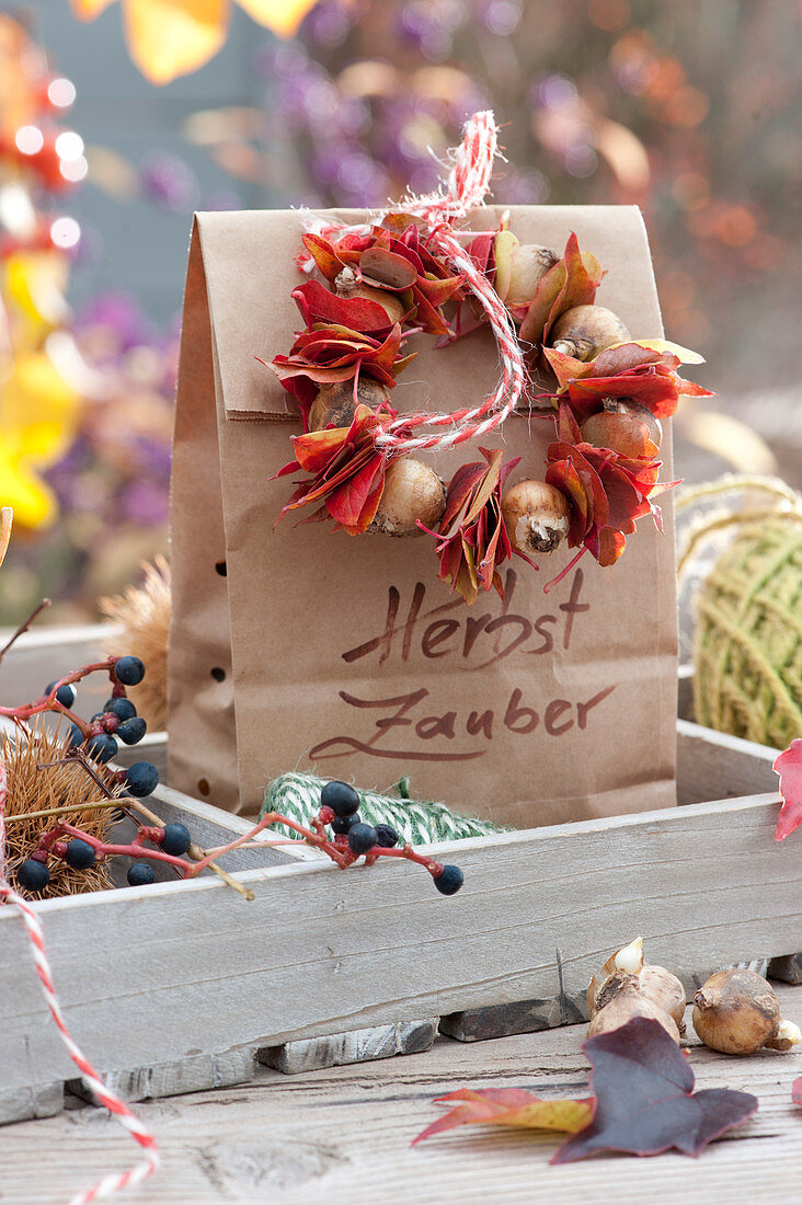 Wreath of leaves and bulbs on paper bag
