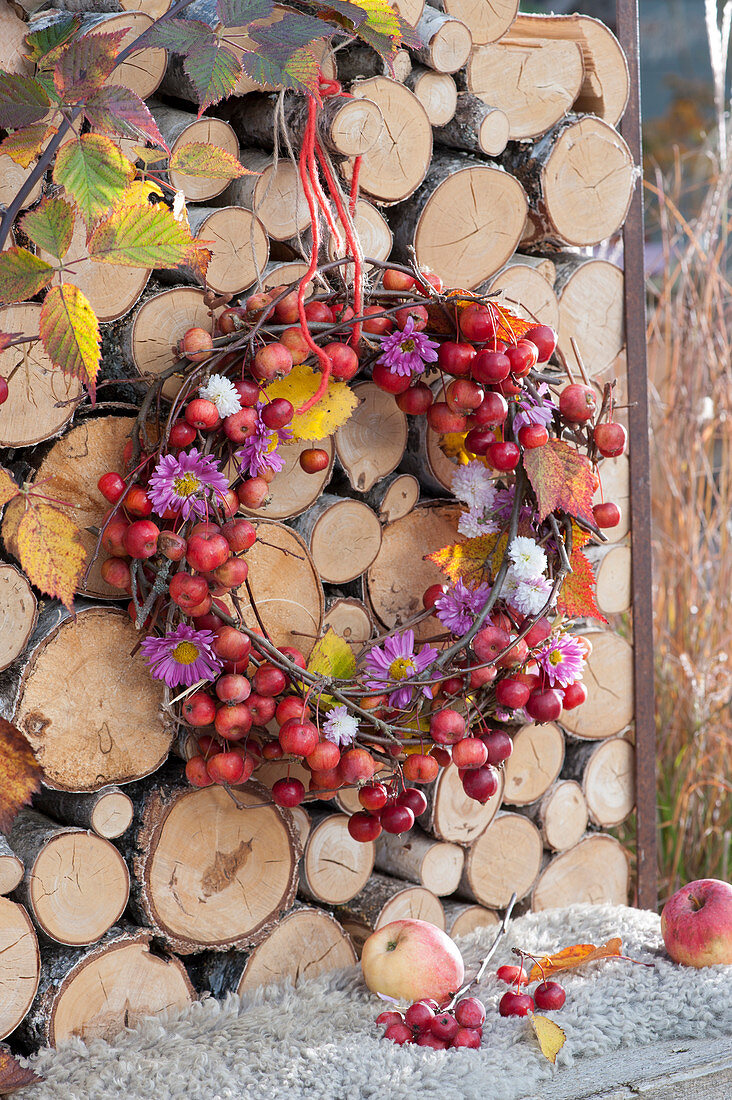 Wreath of crab apples and aster flowers